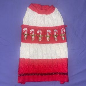 MEDIUM CHRISTMAS DOG SWEATER IN RED AND WHITE WITH CANDY CANES AND POM POM